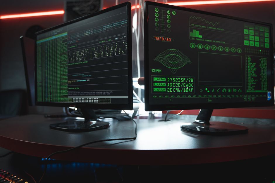 Dual computer monitors with green coding interfaces